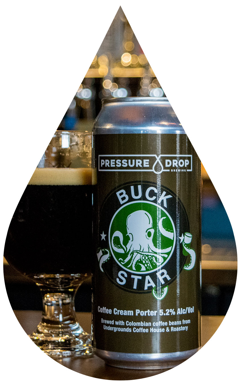 Buckstar can next to beer in glass on bar